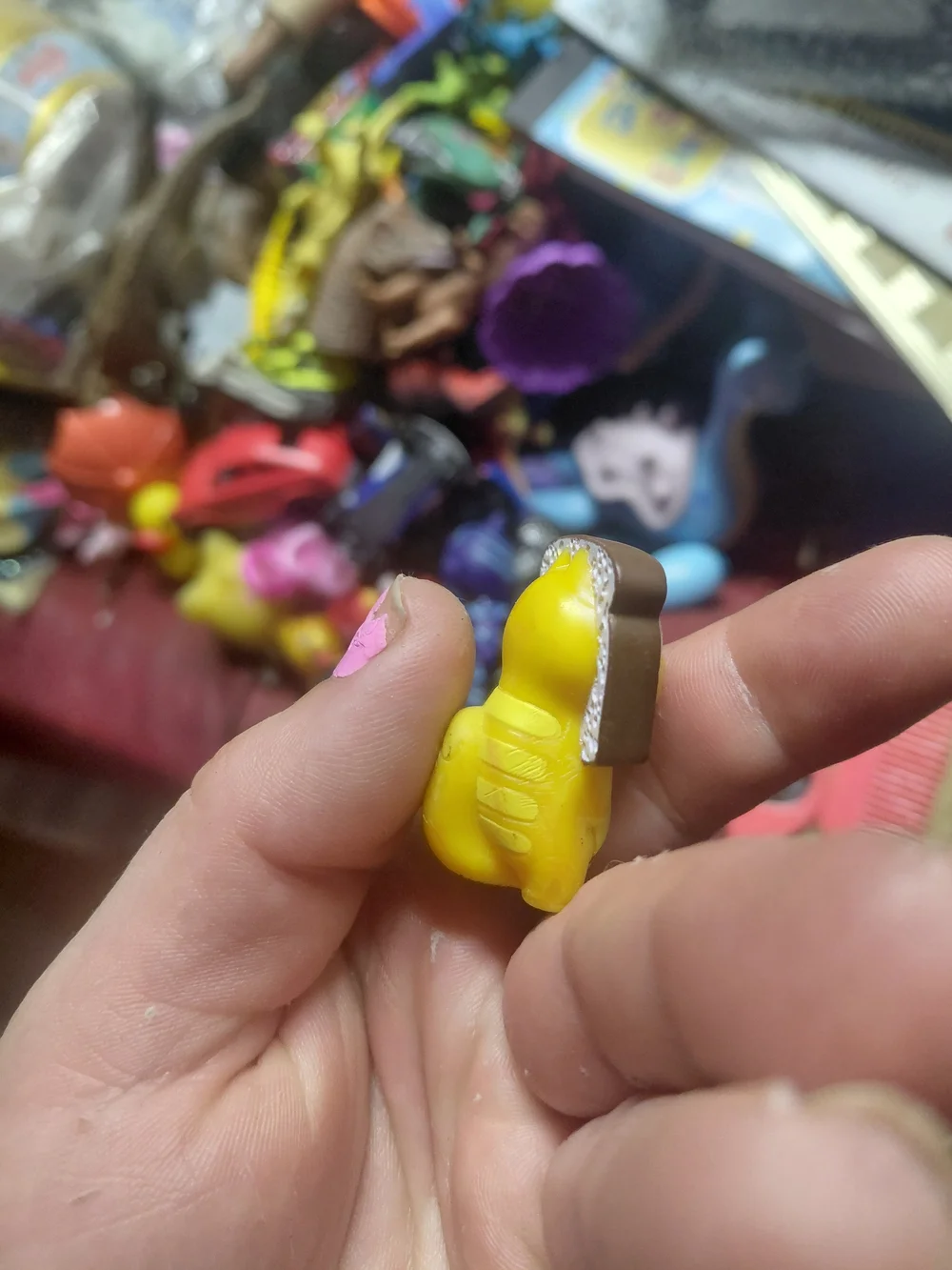 figurine is Loafy, a character from the collectible Hasbro Lost Kitties Series 1